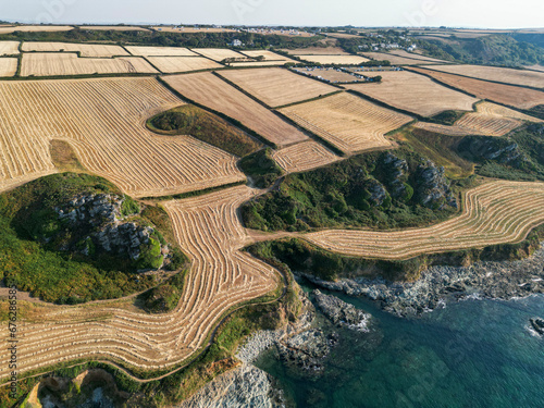 Aerial view of Prawle Point, with farm fields, newly ploughed during hot summer weather photo