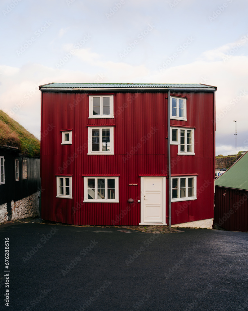 Picturesque historical centre view with typical red-painted grass-roofed houses on Tinganes in the old town of Tórshavn the Captivating Capital of the Faroe Islands on Island Streymoy.