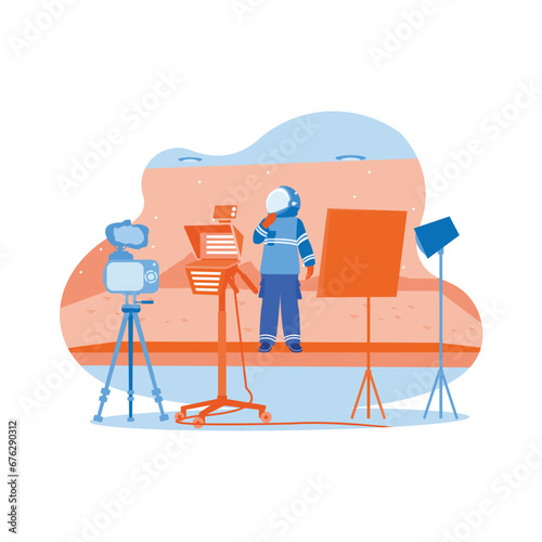 Behind-the-scenes shots of a virtual production stage with a large LED screen, the cinematographer shoots the Mars scene. Filmmaking process. Video Editor concept. 