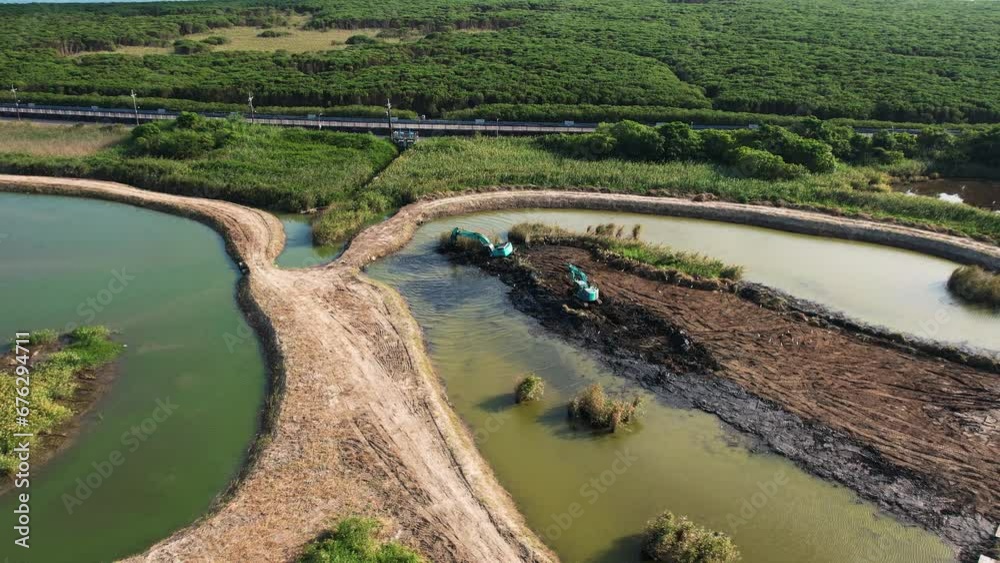 Excavators Working On A Wetlands Restoration Project, Restoring Ecosystem And Environment Excavators Working On A Wetlands Restoration Project, Restoring Ecosystem And Environment