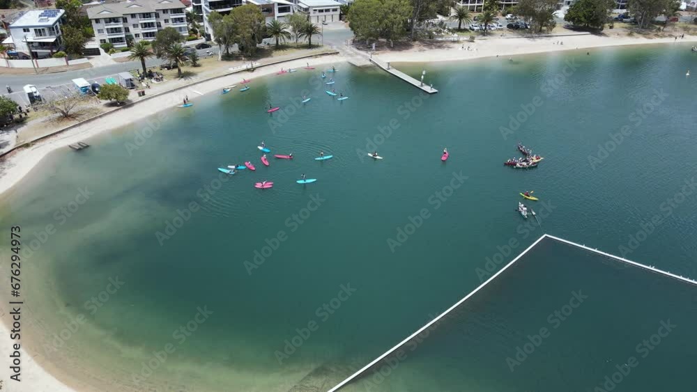 Urban city watersports activity area close to a coastal neighbourhood and popular holiday park. Drone view Urban city watersports activity area close to a coastal neighbourhood and popular holiday park. Drone view