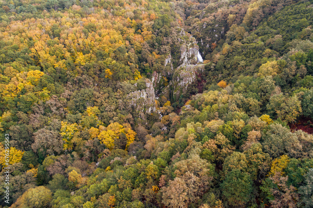 drone aerial view of a waterfall in a mountain forest in autumn drone aerial view of a waterfall in a mountain forest in autumn