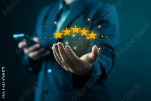 human hand showing 5-star performance that has quality and press level excellent rank for giving the best score point to review the service, business concept Customer Service Experience, and Business
 photo