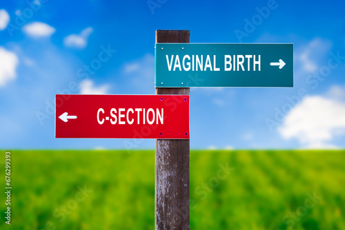 Vaginal Birth vs C-section - Traffic sign with two options - natural delivery vs Caesarean section. Deliver baby using surgery method. Question of risk, pain, maternity hospital. photo