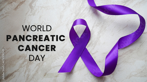 World pancreatic cancer day with purple ribbon. Pancreatic cancer concept, treatment and health awareness. Purple ribbon with pancreatic cancer awareness. photo