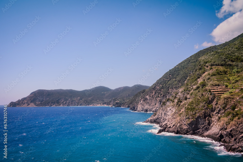 Cliff on mountain in the Mediterranean Sea and Cinque Terre on the horizon, ITALY