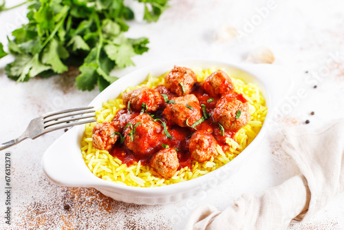 Chicken meatballs with tomato sauce.