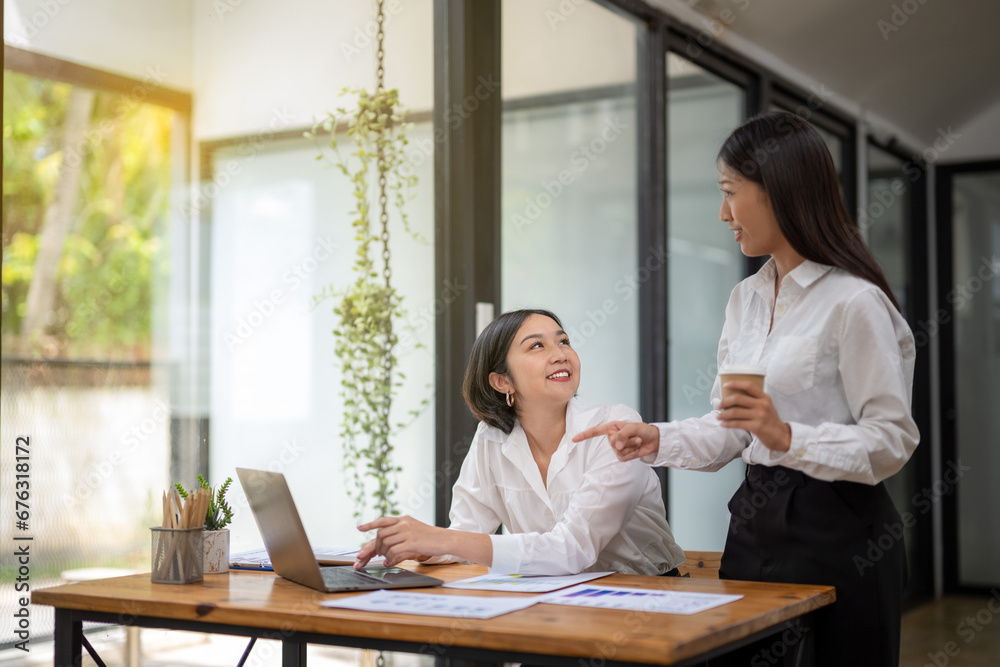 Two business colleagues talking share ideas and express their opinions while working together. Two business colleagues talking share ideas and express their opinions while working together.
