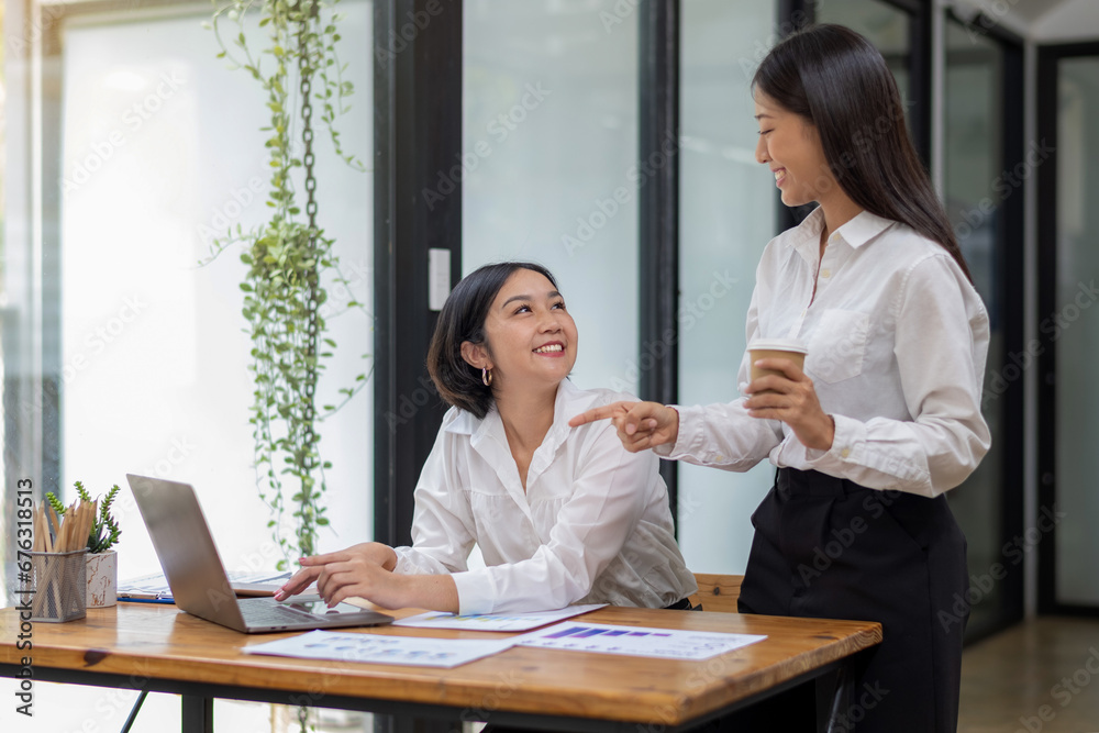 Two business colleagues talking, share ideas and express their opinions while working together. Two business colleagues talking, share ideas and express their opinions while working together.