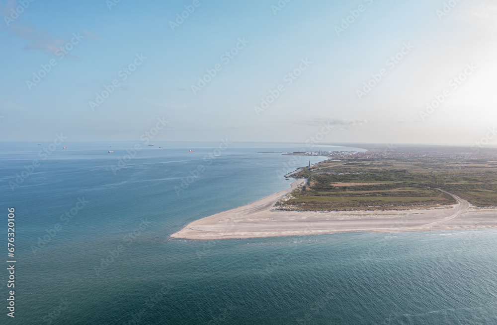 Aerial landscape panorama of Skagen Odde peninsula and Grenen - a meeting point of North and Baltic Sea (Skagerrak and Kattegat). North Jutland, Nordjylland, Denmark