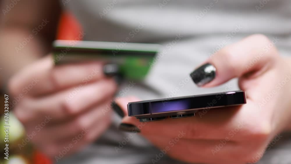 Online shopping. A woman makes an order from a smartphone. Online shopping. A woman makes an order from a smartphone.