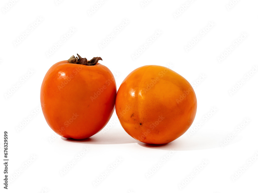 Ripe orange persimmon fruits isolated on a white background. Persimmons on white. Ripe orange persimmon fruits isolated on a white background. Persimmons on white.