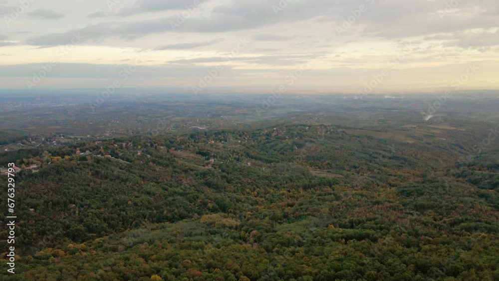 Beautiful aerial view of the wooded area and small houses perched in it Beautiful aerial view of the wooded area and small houses perched in it