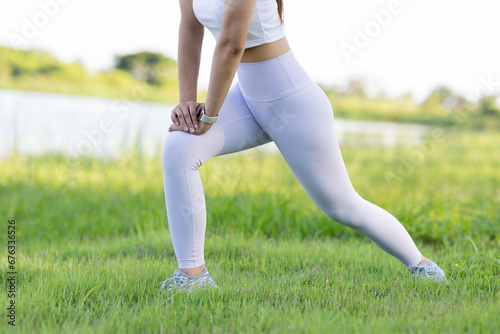 Portrait of a small, fit Asian woman exercising outside.