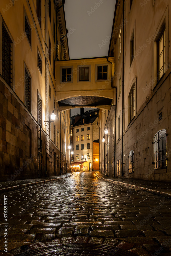 Stockholm, Sweden  The Norra Bankogrand street in Gamla Stan or Old Town in the rain at night