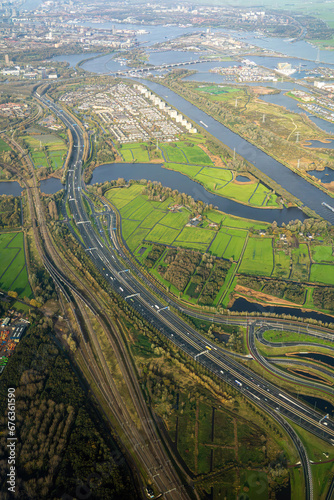 Amsterdam, Holland A view of a city highway and train tracks from an airplane approaching Schiphol airport.
