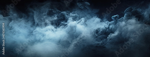 Blue fog on the floor. Dark scene with blue smoke.