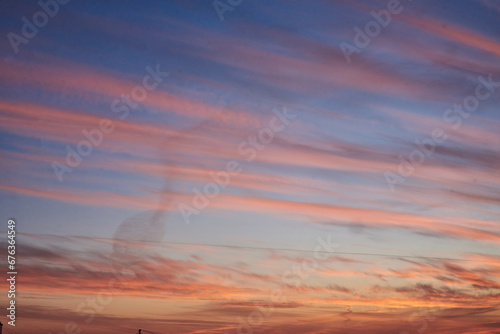 An amazing landscape view at sunrise with red orange blue vivid sky. Natural background with suburbs of the city and beautiful;fields. Nature conservation concept. Eco friendly. Universe.