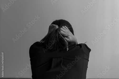 woman on her back in a supplicating position during a prayer