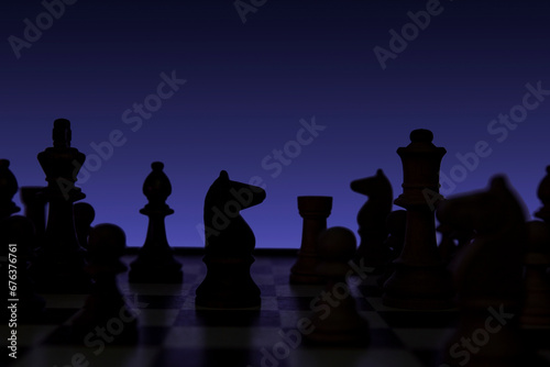Knight in a chess duel on the chessboard. Low-key concept picture of chess pieces taken in studio and concerning decision making and strategy. photo