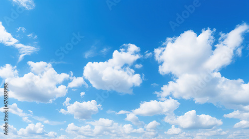 White clouds drifting in a clear blue sky.