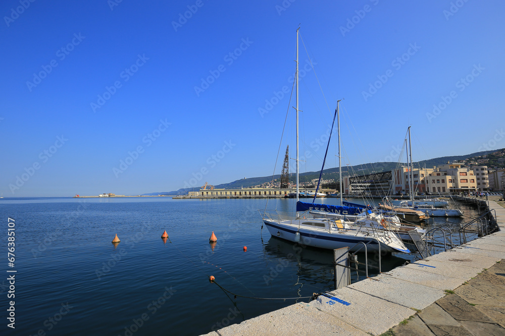 Trieste, Italy - 20 July, 2019: Sailing boats moored near the shore