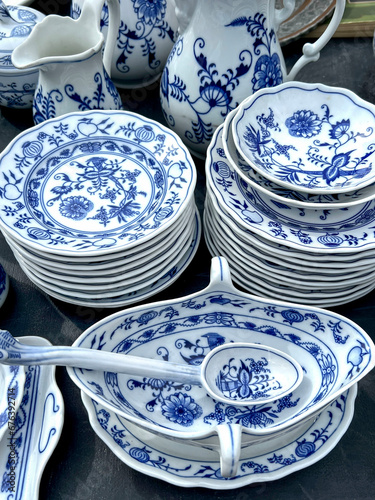 Canvas Print stack of blue and white porcelain plates and dishes on table