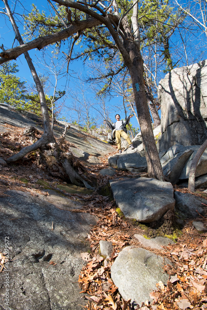 A chinese woman on the whitestone cliffs trail in plymouth connecticut A chinese woman on the whitestone cliffs trail in plymouth connecticut