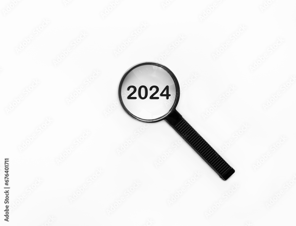 Magnifying glass focusing on year 2024 for new business linked to happy new year and merry Christmas concept Magnifying glass focusing on year 2024 for new business linked to happy new year and merry Christmas concept