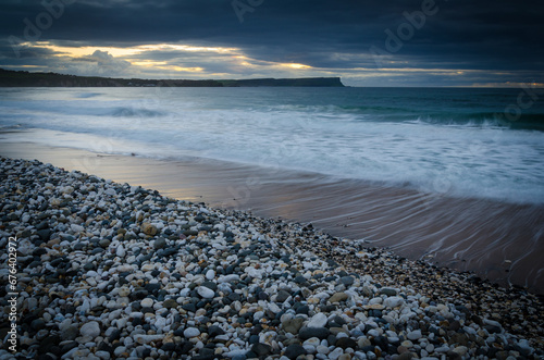 The blue hour at Whitepark Bay in County Antrim in Northern Ireland  photo