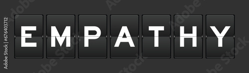 Black color analog flip board with word empathy on gray background