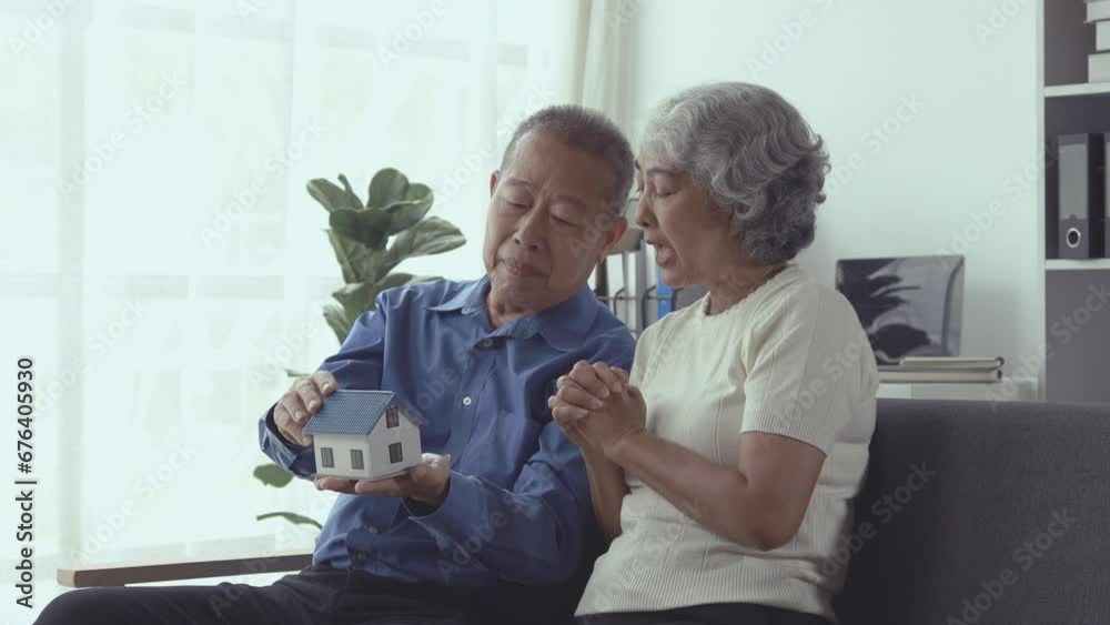 An elderly couple is spending their free time doing various activities. In a shared living room, taking care of each other in old age, the concept of living together for a retired couple. An elderly couple is spending their free time doing various activities. In a shared living room, taking care of each other in old age, the concept of living together for a retired couple.