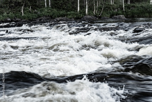 Beautiful shot of splashing river waves in a rocky stream