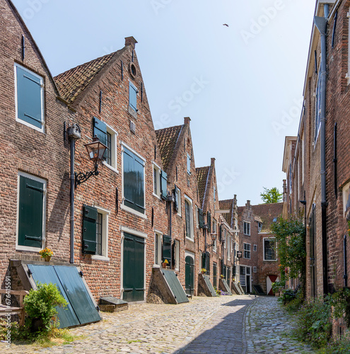 This street, De Kuiperpoort, is located in the idyllic heart of Middelburg, with 17th century buildings and typical cellar shutters. photo