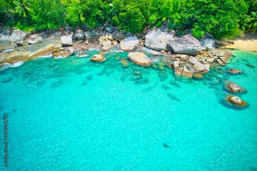 Drone photography of white sandy beach  granite rocks  turquoise and transparent water  near the shore  sunset beach  Mahe  Seychelles 1