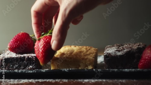 White chocolate and dark chocolate brownie services. and red fruits. photo