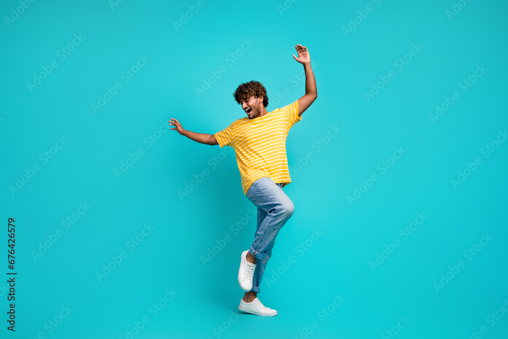 Full body photo of cheerful overjoyed person raise hands chilling dancing isolated on teal color background