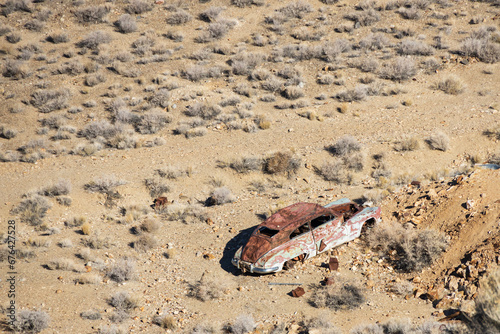Old rusted out car in the desert