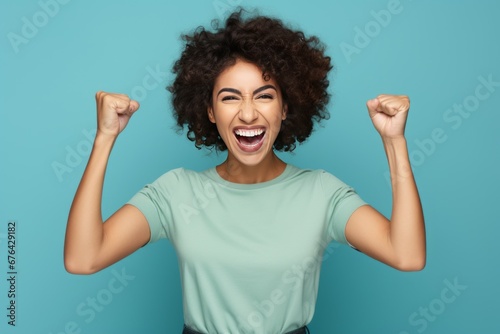 Young Woman Celebrating Victory with Flexed Arms