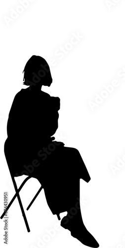 silhouette of a woman sitting on a chair carrying a coffee cup