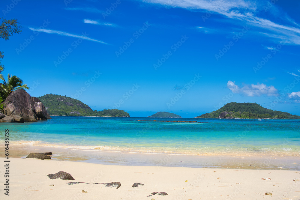  Sunny, white sandy beach, turquoise water at port glaud beach, Mahe, Seychelles. 4.