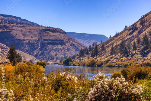 Deshutes River at the base of rimrock cliffs in Eastern, Oregon, USA photo