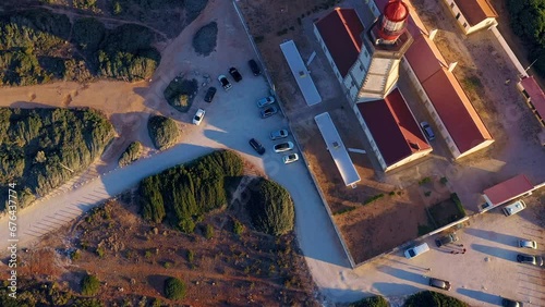 Tiliting drone shot of lighthouse and landscape, cape Espichel at photo