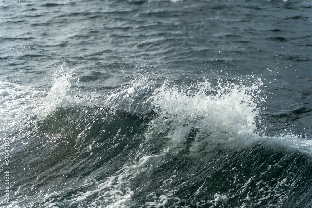Closeup of a small wave at the Baltic Sea Closeup of a small wave at the Baltic Sea