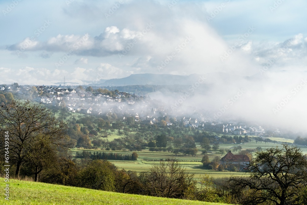 Beautiful view of the Nurtingen town in the Swabian Alps covered with fog in autumn Beautiful view of the Nurtingen town in the Swabian Alps covered with fog in autumn