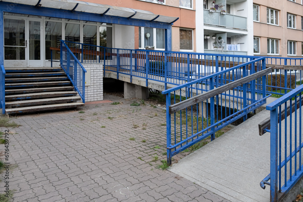 Ramp construction for disabled people in typical Europe apartment building entrance. Ramp for wheelchair Ramp construction for disabled people in typical Europe apartment building entrance. Ramp for wheelchair