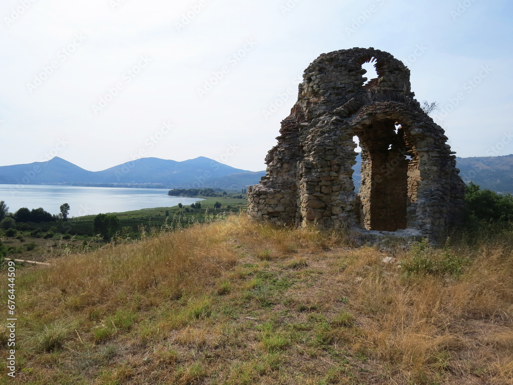 Ruins of an ancient arched stone church in Northern Greece, overlooking Lake Orestiada