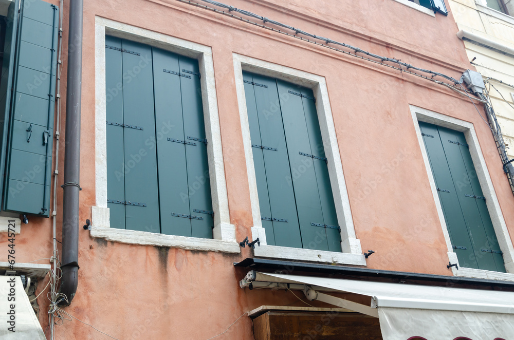 Closed windows on a typical Venetian residential house - detail