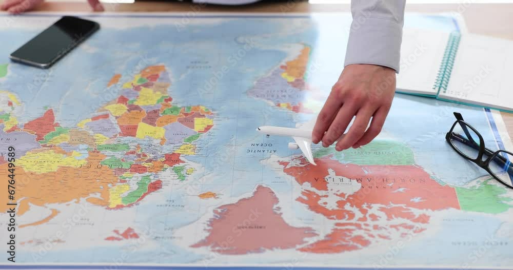 Airplane model flies through the world map and mobile phone Airplane model flies through the world map and mobile phone