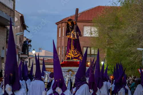 People wearing uniforms and bearing the statue of Jesus Christ in the holy week (Semena Santa) photo